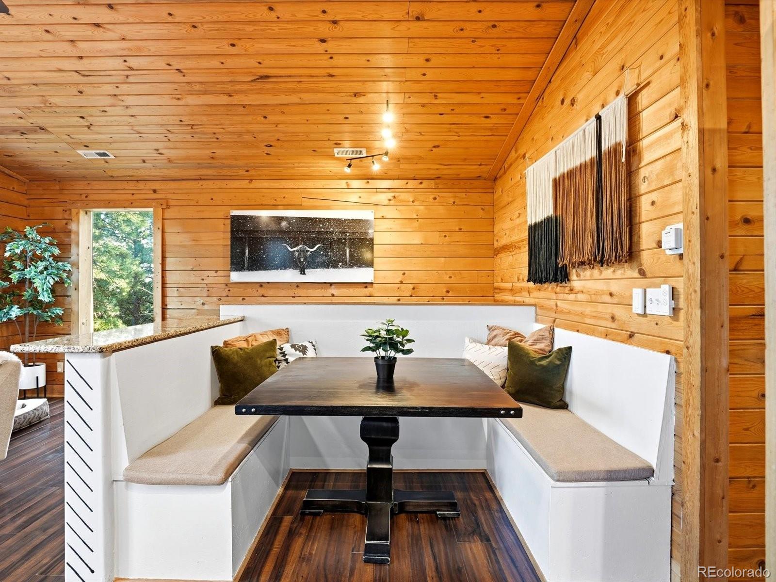 201 Moss Rock Road Bailey, CO 80421 - Photo 20 of 43 a outdoor living space with furniture and a flat screen tv