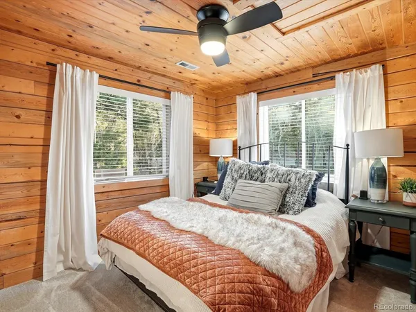 a bathroom with a sink a mirror and a window