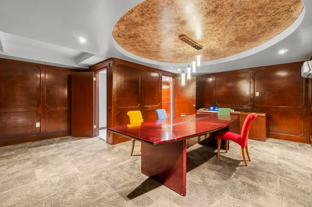 a view of a big room with a large tree