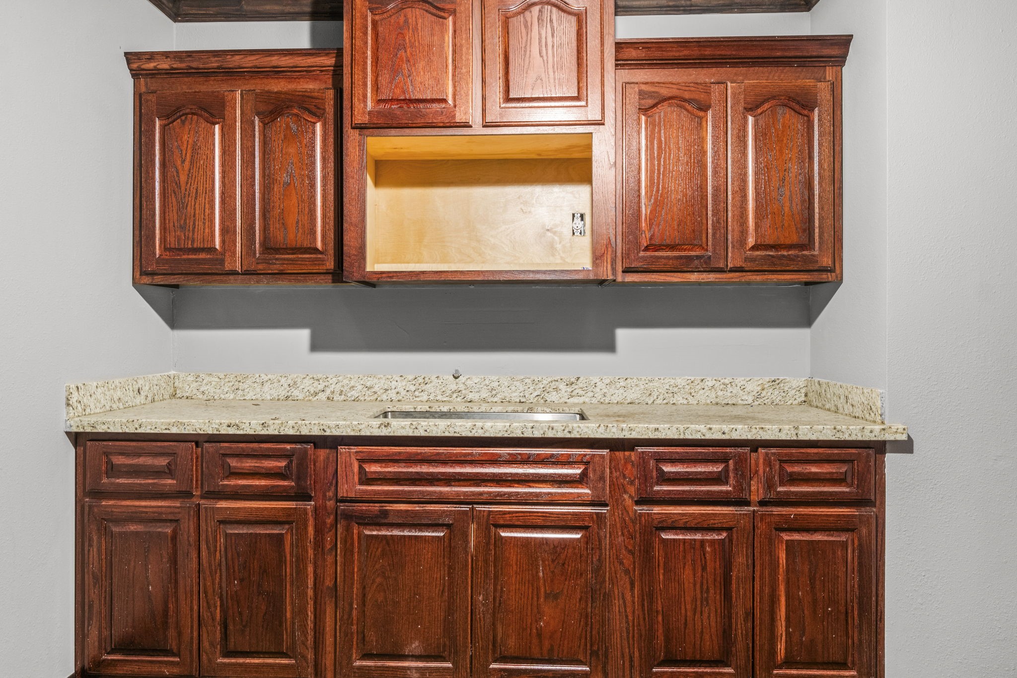1018 Shaver Street Pasadena, TX 77506 - Photo 18 of 43 Built-in cabinetry with granite counters—perfect for storage or break-room use.