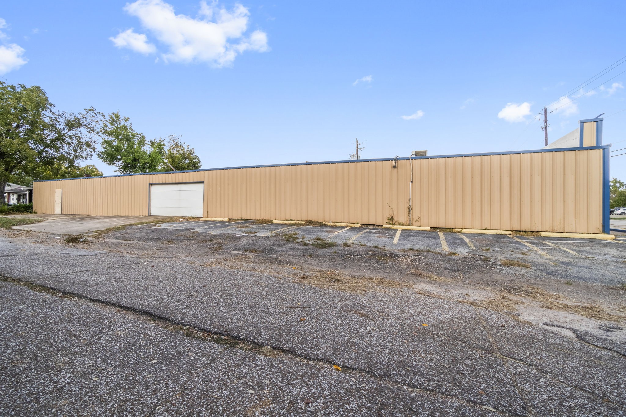 1018 Shaver Street Pasadena, TX 77506 - Photo 26 of 43 Rear elevation with wide driveway and additional parking availability.