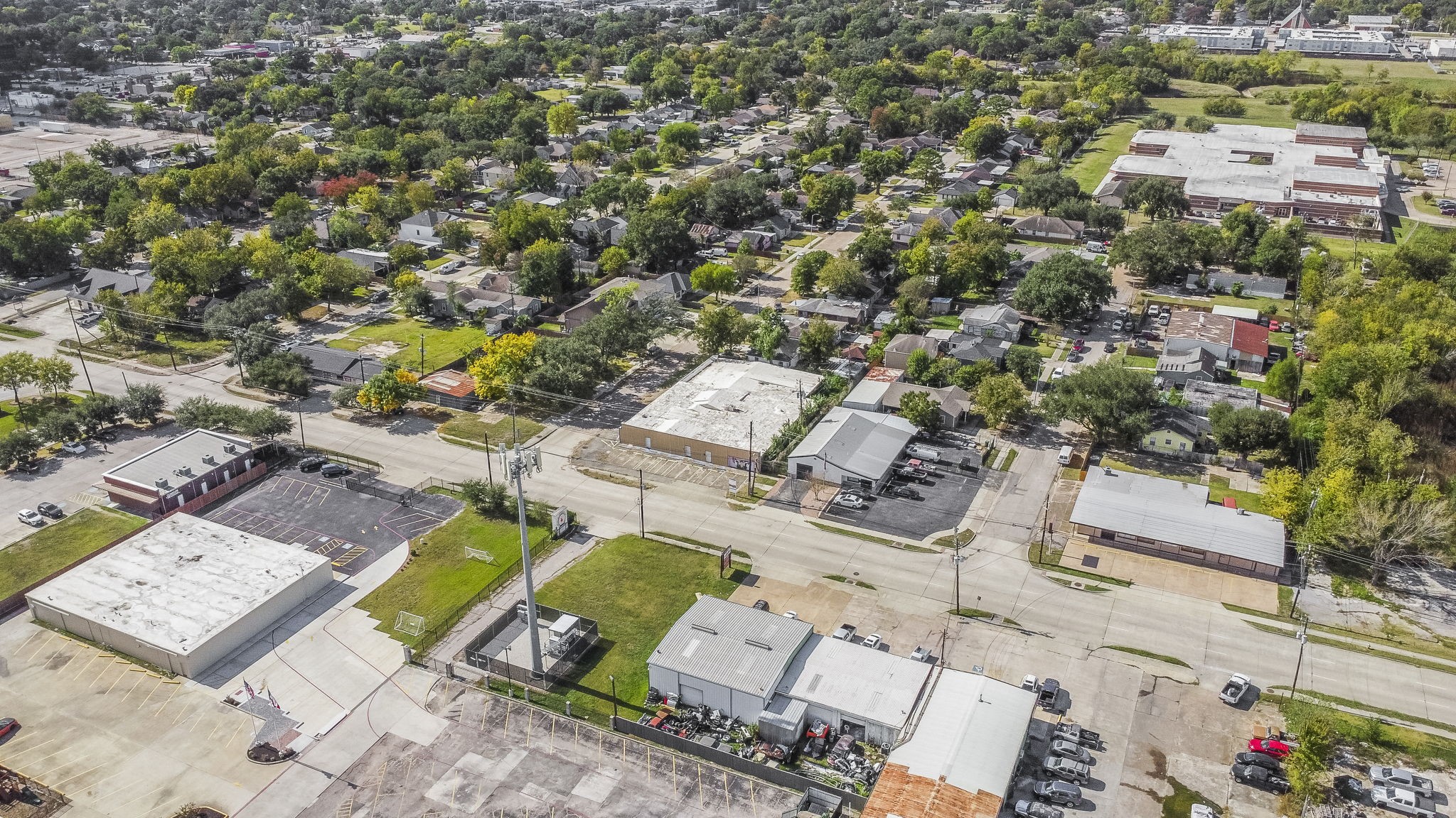 1018 Shaver Street Pasadena, TX 77506 - Photo 34 of 43 an aerial view of a house with a swimming pool and lake view