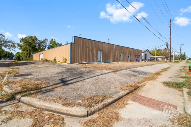 a outdoor space with a table and chairs