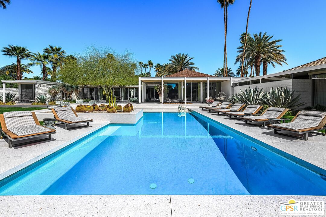 611 North Phillips Road Palm Springs, CA 92262 - Photo 2 of 10 a view of a house with pool and chairs