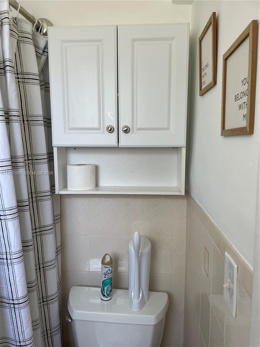 5800 Southwest 61st Street Miami, FL 33143 - Photo 20 of 26 a bathroom with a sink and a mirror