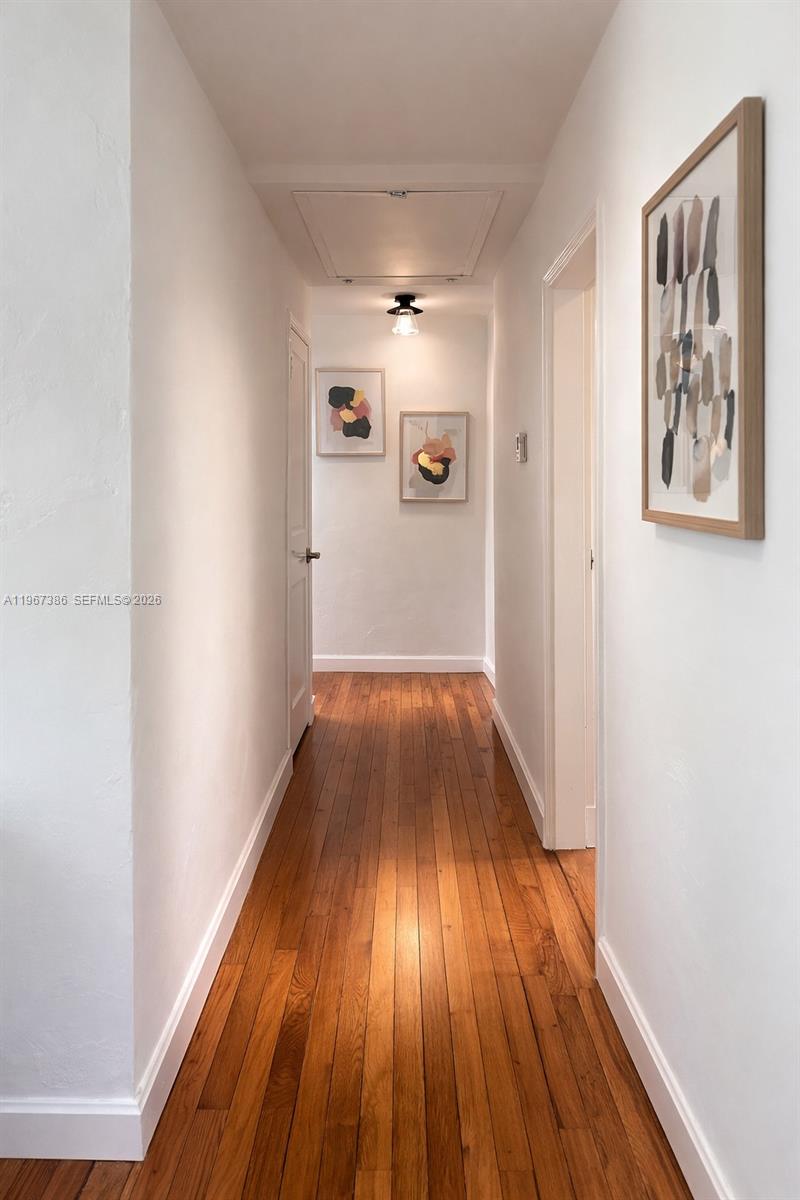 5800 Southwest 61st Street Miami, FL 33143 - Photo 10 of 26 a view of hallway with wooden floor