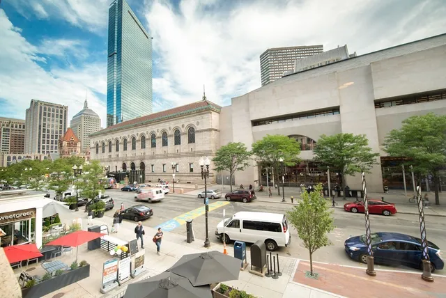 a view of a patio with table and chairs and potted plants