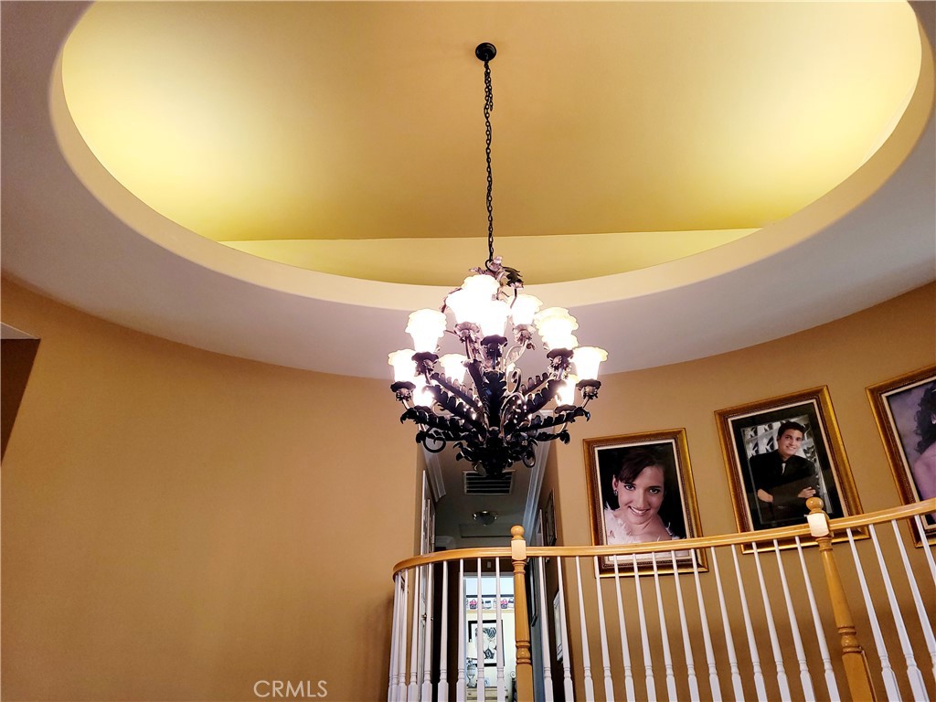14119 Ashton Lane Riverside, CA 92508 - Photo 34 of 47 a dining room with furniture and chandelier