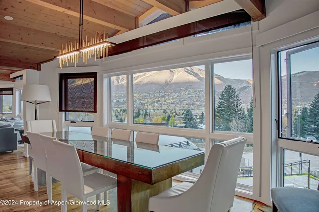 a backyard of a house with yard and outdoor seating