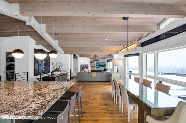 a view of a living room and kitchen