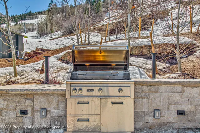 a view of a chairs and table in the patio