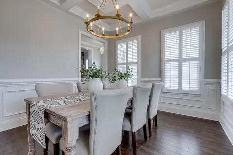 a dining room with furniture and window
