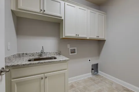 a bathroom with a sink and cabinets