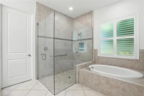 a bathroom with a bathtub and shower