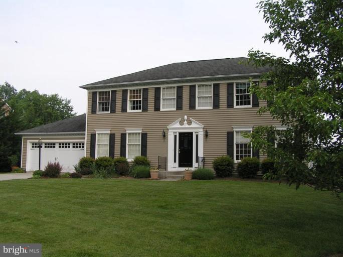 1203 Brookview Road Towson, MD 21286 - Photo 1 of 25 a front view of a house with a garden
