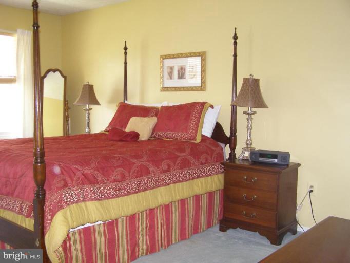 1203 Brookview Road Towson, MD 21286 - Photo 12 of 25 a bed room with a bed and a dresser