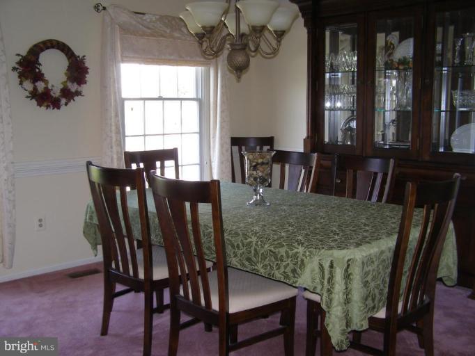 1203 Brookview Road Towson, MD 21286 - Photo 14 of 25 a view of a dining room with furniture and window