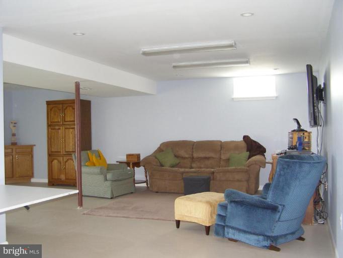 1203 Brookview Road Towson, MD 21286 - Photo 20 of 25 a living room with furniture and a flat screen tv