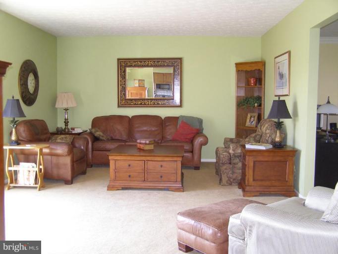 1203 Brookview Road Towson, MD 21286 - Photo 5 of 25 a bedroom with furniture and a wooden floor