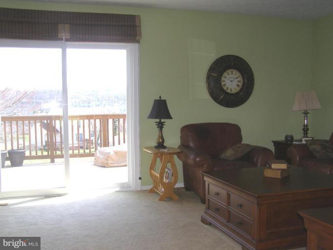 1203 Brookview Road Towson, MD 21286 - Photo 9 of 25 a living room with furniture and a large window