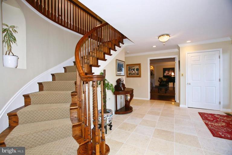 10306 Norton Road Potomac, MD 20854 - Photo 2 of 14 a view of entryway and hall with wooden floor