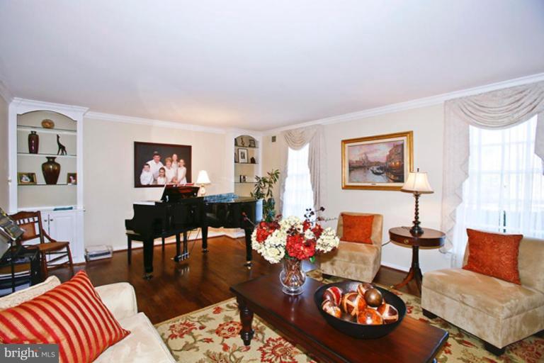 10306 Norton Road Potomac, MD 20854 - Photo 3 of 14 a living room with furniture and a table