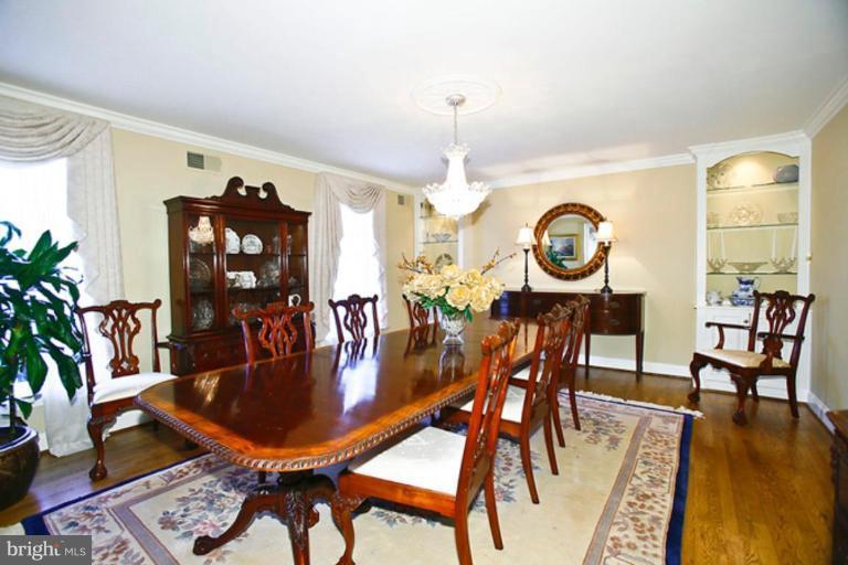 10306 Norton Road Potomac, MD 20854 - Photo 4 of 14 a dining room with furniture and wooden floor