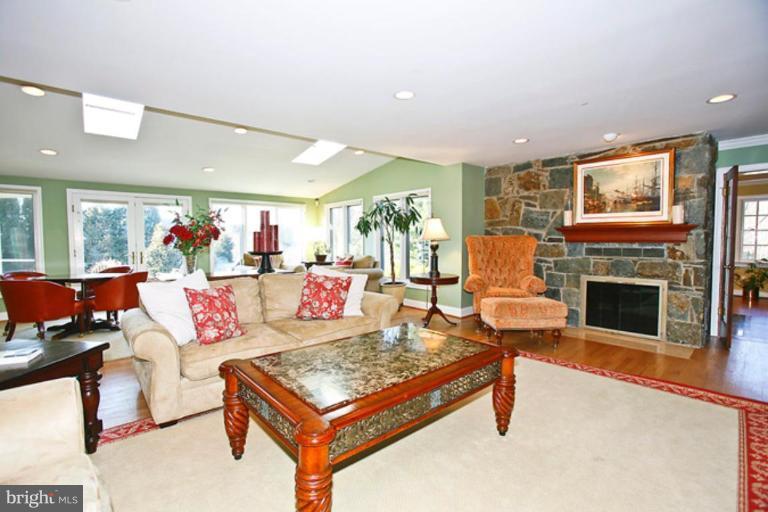 10306 Norton Road Potomac, MD 20854 - Photo 7 of 14 a living room with furniture and a fireplace