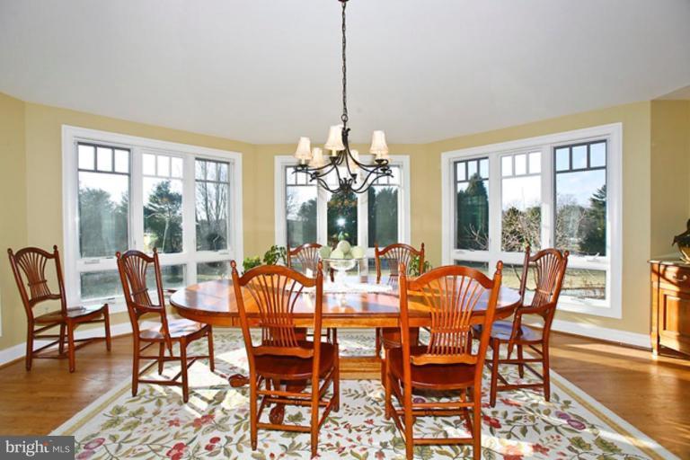 10306 Norton Road Potomac, MD 20854 - Photo 9 of 14 a view of a dining room with furniture window and wooden floor