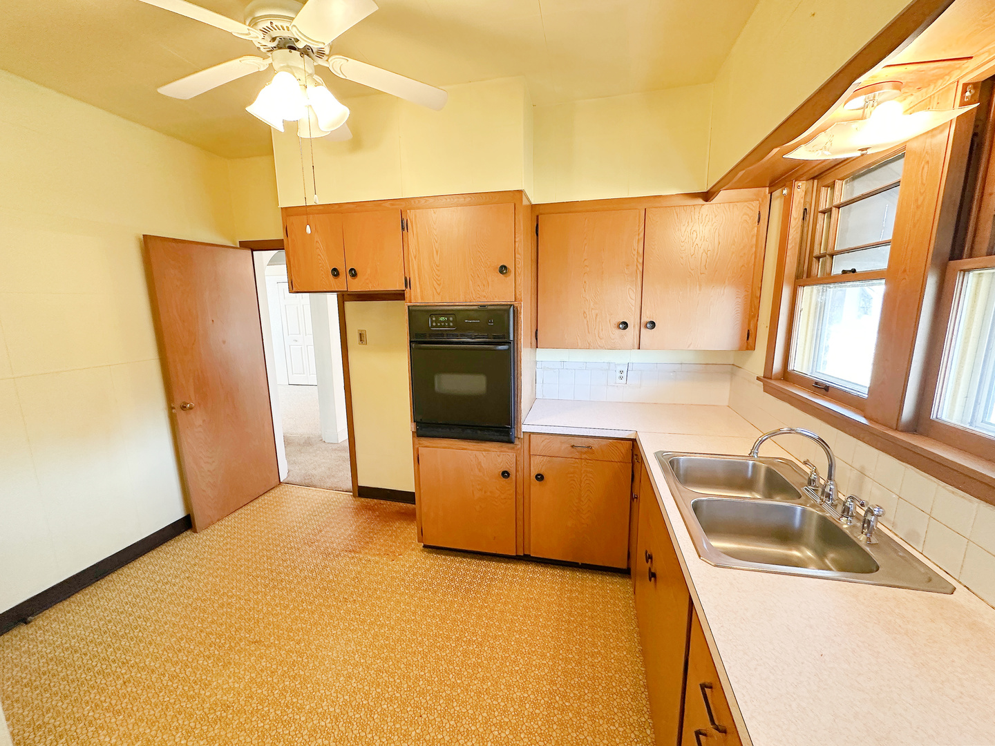 1126 East Main Street Streator, IL 61364 - Photo 12 of 23 a kitchen with stainless steel appliances granite countertop a sink a refrigerator and a stove
