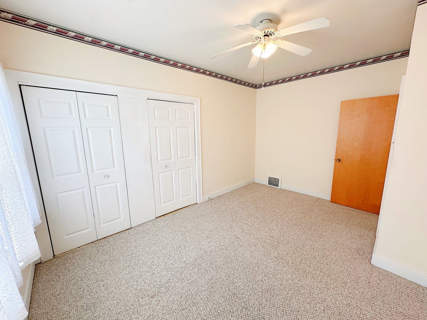 1126 East Main Street Streator, IL 61364 - Photo 13 of 23 a view of a livingroom with a ceiling fan and hardwood