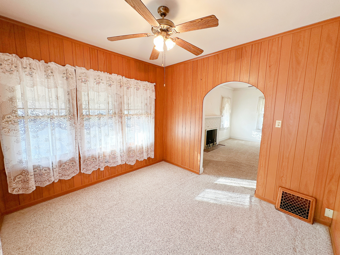 1126 East Main Street Streator, IL 61364 - Photo 7 of 23 a view of an empty room with a window
