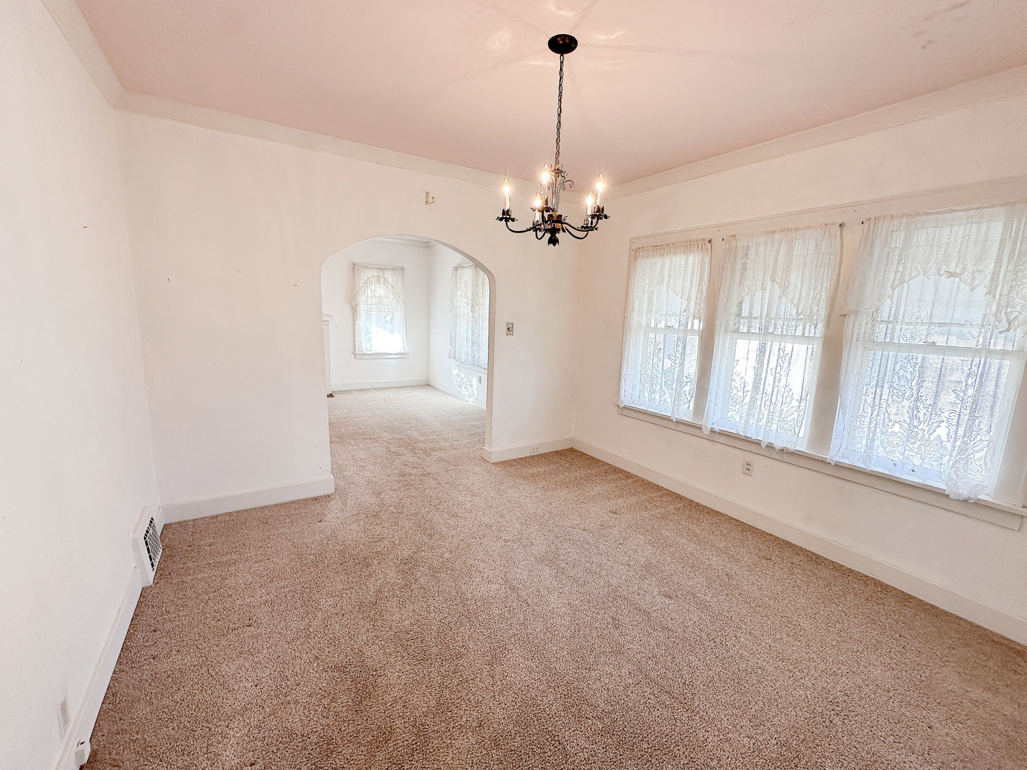 1126 East Main Street Streator, IL 61364 - Photo 8 of 23 a view of a livingroom with a chandelier