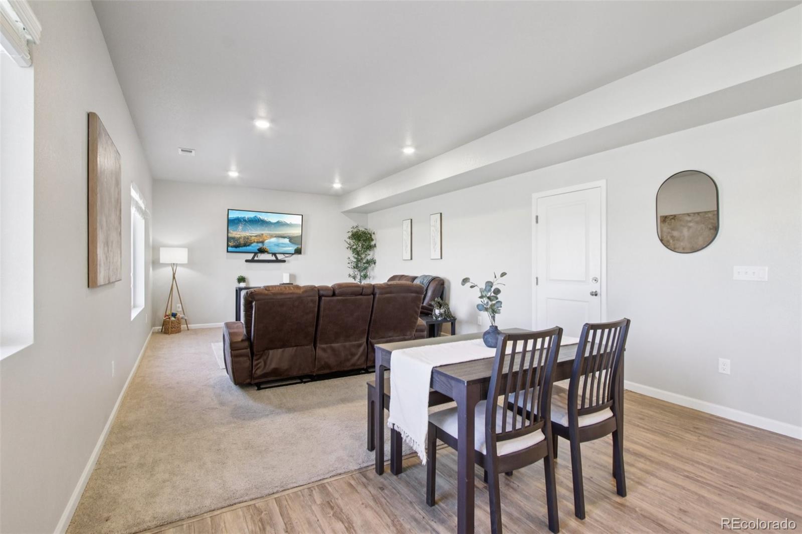 1907 Homestead Drive Fort Lupton, CO 80621 - Photo 14 of 47 a living room with furniture and a wooden floor