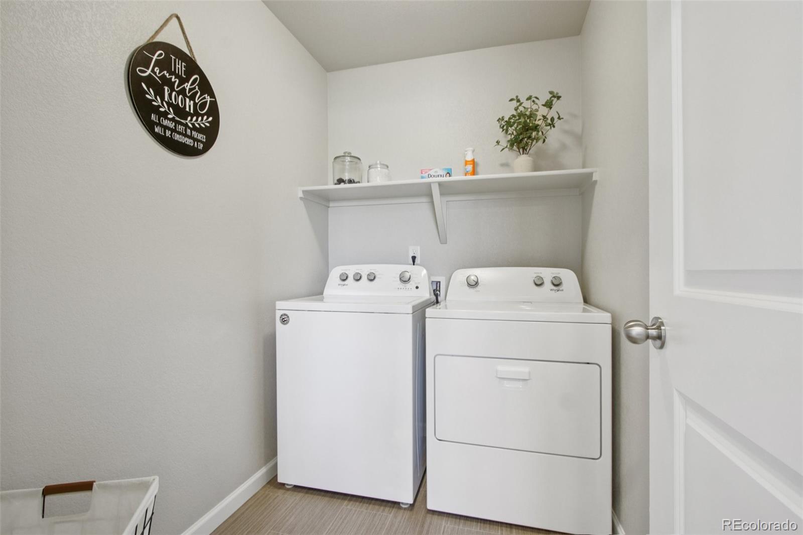 1907 Homestead Drive Fort Lupton, CO 80621 - Photo 26 of 47 a utility room with dryer and washer