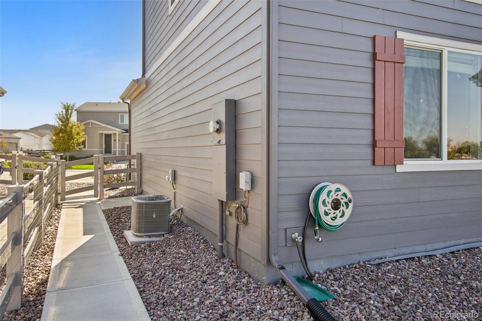 1907 Homestead Drive Fort Lupton, CO 80621 - Photo 38 of 47 view of a house with wooden door