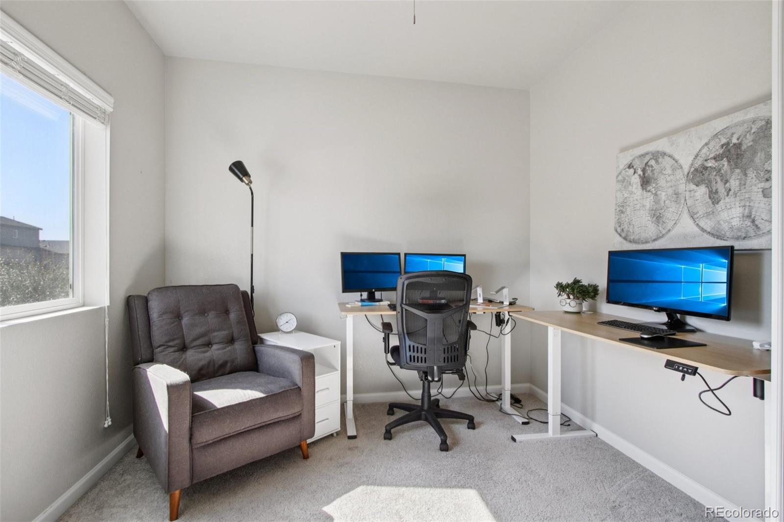 1907 Homestead Drive Fort Lupton, CO 80621 - Photo 5 of 47 a view of workspace with a couch