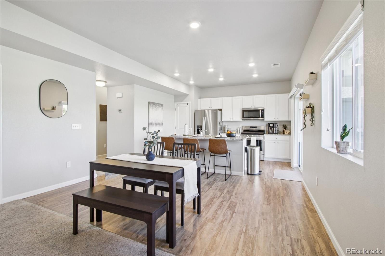 1907 Homestead Drive Fort Lupton, CO 80621 - Photo 6 of 47 a view of kitchen with cabinets and wooden floor
