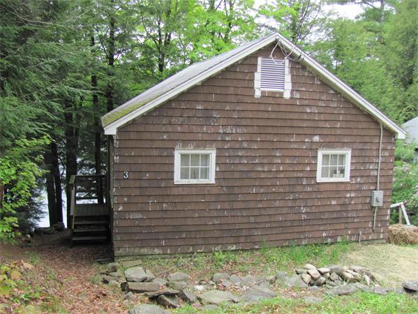 3 Adams Road Goshen, MA 01096 - Photo 3 of 8 a brick house with a yard