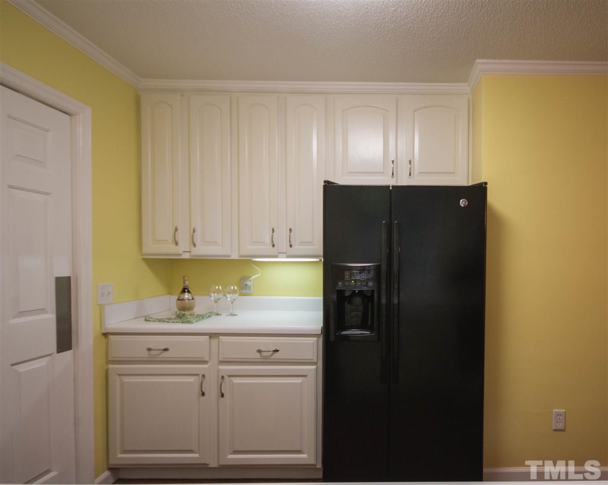 7626 Herndon Road Durham, NC 27713 - Photo 12 of 25 The side by side refrigerator/freezer is adjacent to additional cabinetry and countertop. The is also a pantry next to the Breakfast Area.