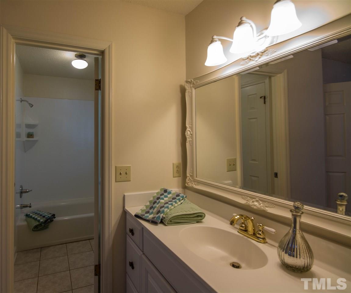 7626 Herndon Road Durham, NC 27713 - Photo 16 of 25 The sink and vanity area is separate from the tub/shower and water closet. The tub area has ceramic tile flooring.