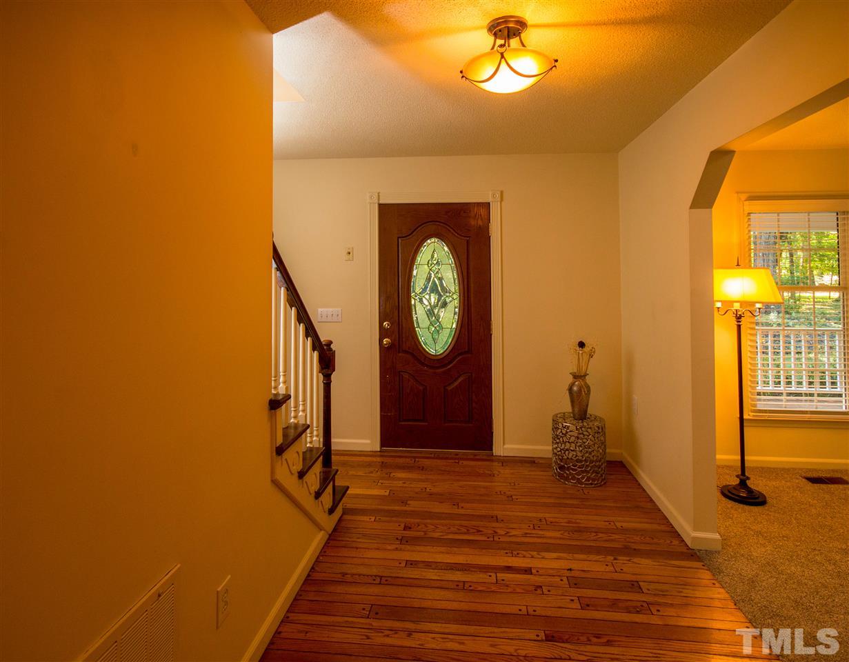 7626 Herndon Road Durham, NC 27713 - Photo 4 of 25 Front door has leaded glass accent.
