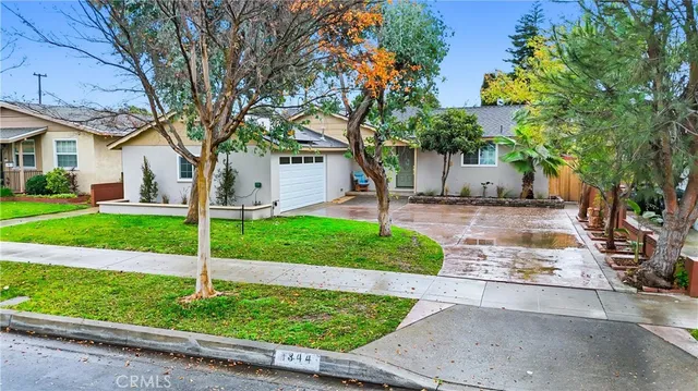 an aerial view of a house with a garden