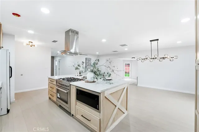 a kitchen that has a stove and a sink