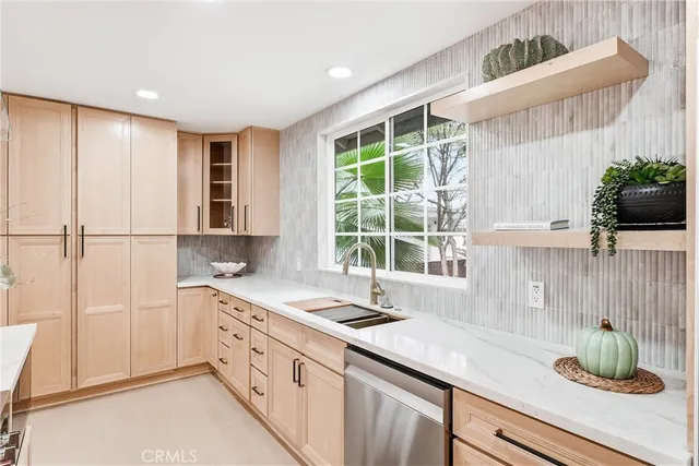 a kitchen with a sink and a window