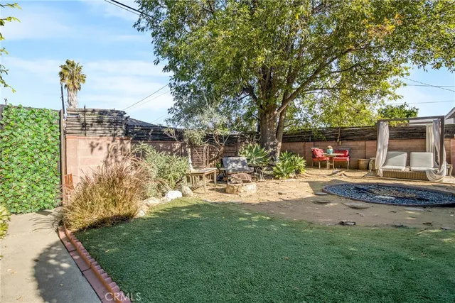 a view of yard with swimming pool and sitting area