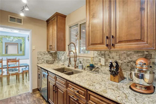 a kitchen with a sink and cabinets