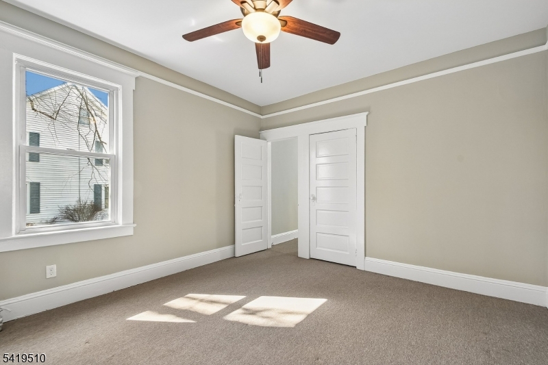 68 North Street, Unit 2 Madison, NJ 07940 - Photo 12 of 18 a view of an empty room with a window