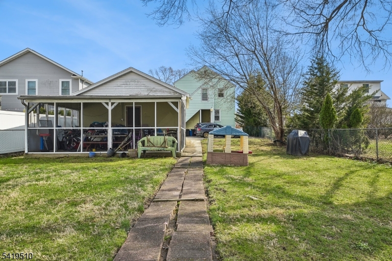 68 North Street, Unit 2 Madison, NJ 07940 - Photo 16 of 18 a front view of a house with a yard