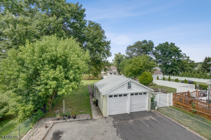 68 North Street, Unit 2 Madison, NJ 07940 - Photo 18 of 18 a view of a house with a yard and large tree